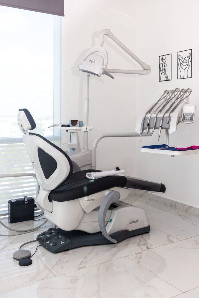 Happy child receiving a gentle and fun dental checkup at Vanity Aesthetics in Cancun.