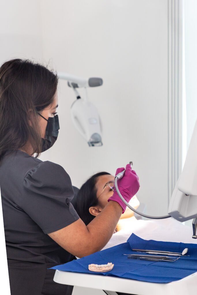 Close-up of a patient's teeth before and after Zoom!® teeth whitening treatment at Vanity Aesthetics in Cancun.