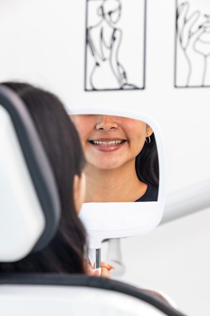 Happy child receiving a gentle dental checkup at Vanity Aesthetics in Cancun.