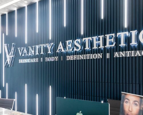 The modern and inviting lobby of Vanity Aesthetics clinic, featuring comfortable seating and stylish decor.