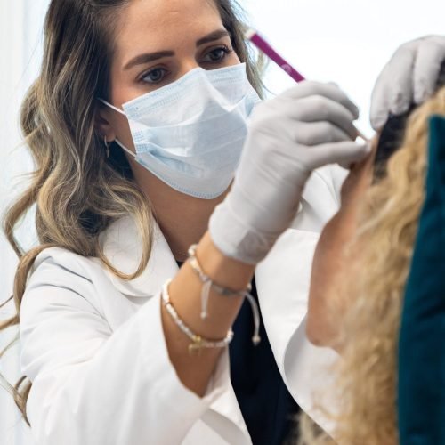 Botox injection being administered to smooth forehead wrinkles at Vanitya Aesthetics