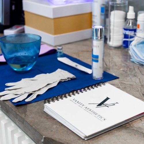 Skincare essentials neatly arranged on a countertop, showcasing the tools and products used in our customized facials.